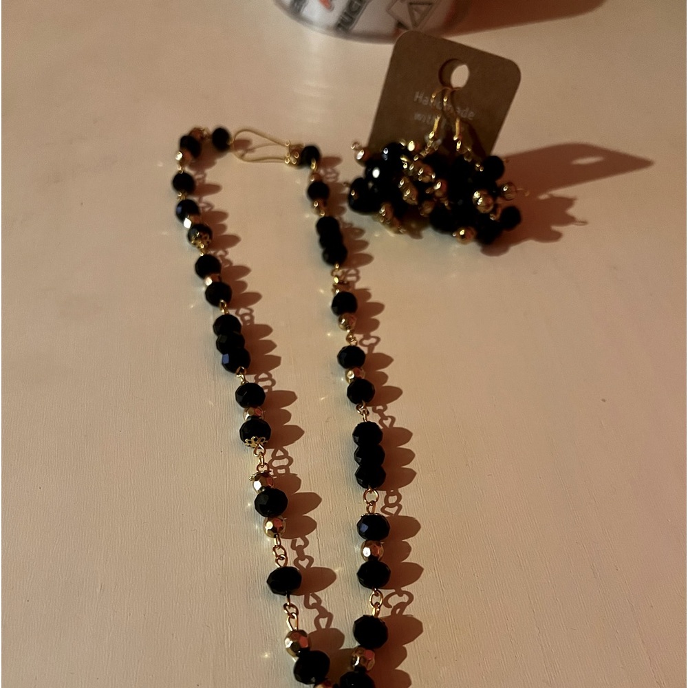 These are handmade necklace and earrings set. Black and gold